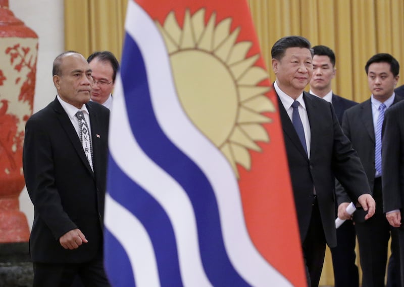 China's President Xi Jinping, third from right, and Kiribati's President Taneti Maamau, left, attend a welcoming ceremony at the Great Hall of the People in Beijing, Jan. 6, 2020.