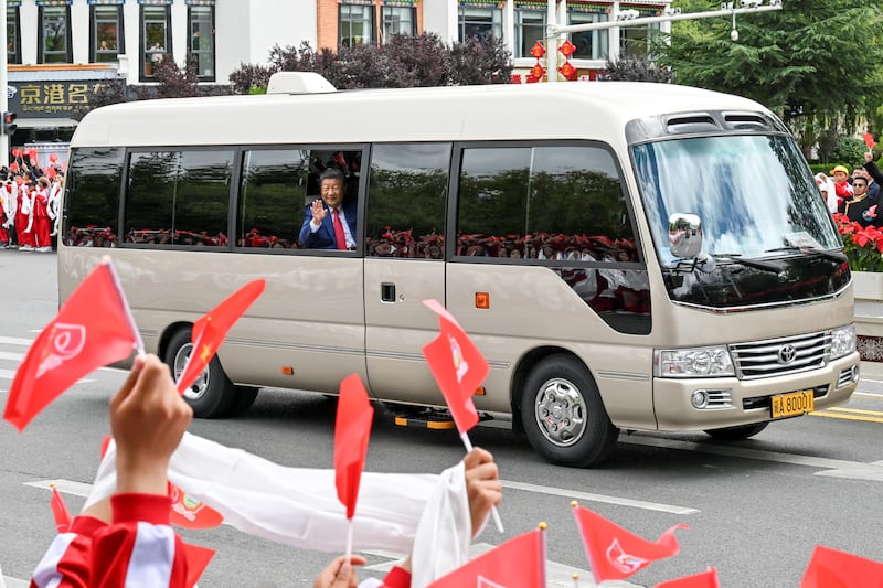 Chinese President Xi Jinping waves to the crowd as he departs Lhasa, Tibet Autonomous Region, Aug. 21, 2025.